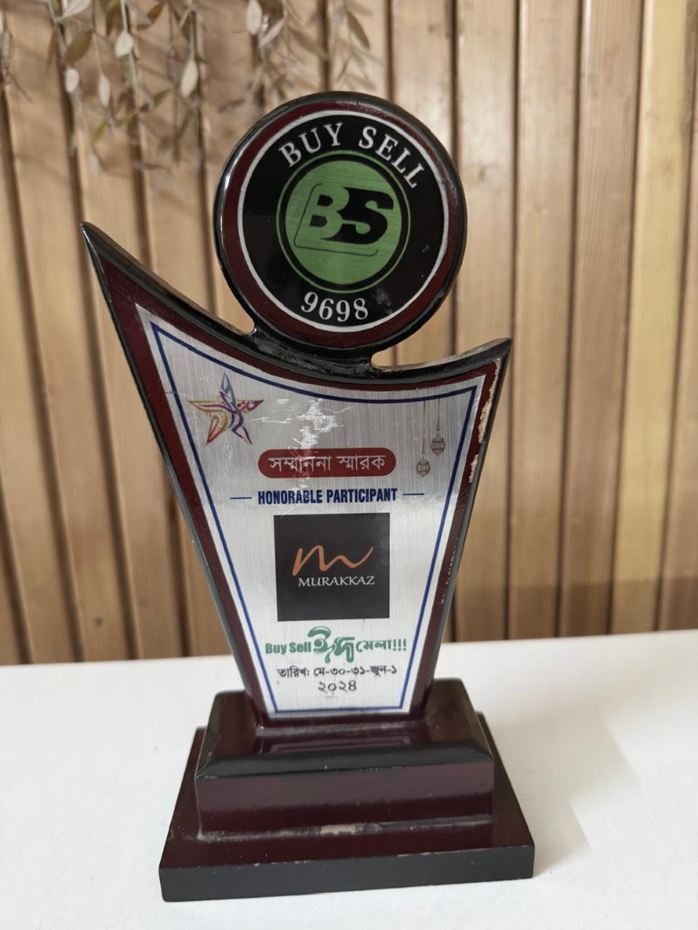 Commemorative crest presented to Murakkaz as an Honorable Participant at Buy Sell Eid Mela 2024